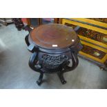 A Chinese carved mahogany circular jardiniere stand