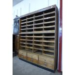 A mid 20th Century oak and beech haberdashery shop cabinet, 184cms h 152cms w, 46cms d
