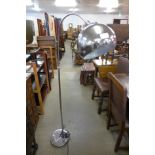 A chrome arc floor standing lamp