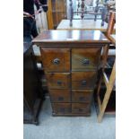 A hardwood eight drawer spice chest