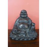 An oriental bronzed seated Buddha