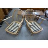 A pair of Ercol Blonde armchairs