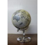 A small terrestrial globe on stand