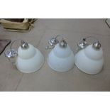 A set of three glass ceiling lights