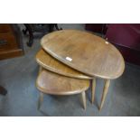 An Ercol Blonde pebble shaped nest of tables