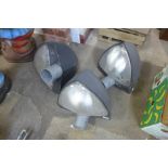 A set of three industrial lights