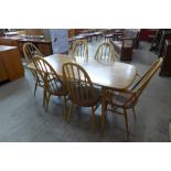 An Ercol Blonde table and six chairs