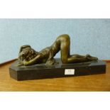 A bronze figure of an erotic female nude