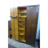 A 1930's fitted oak Compactum wardrobe