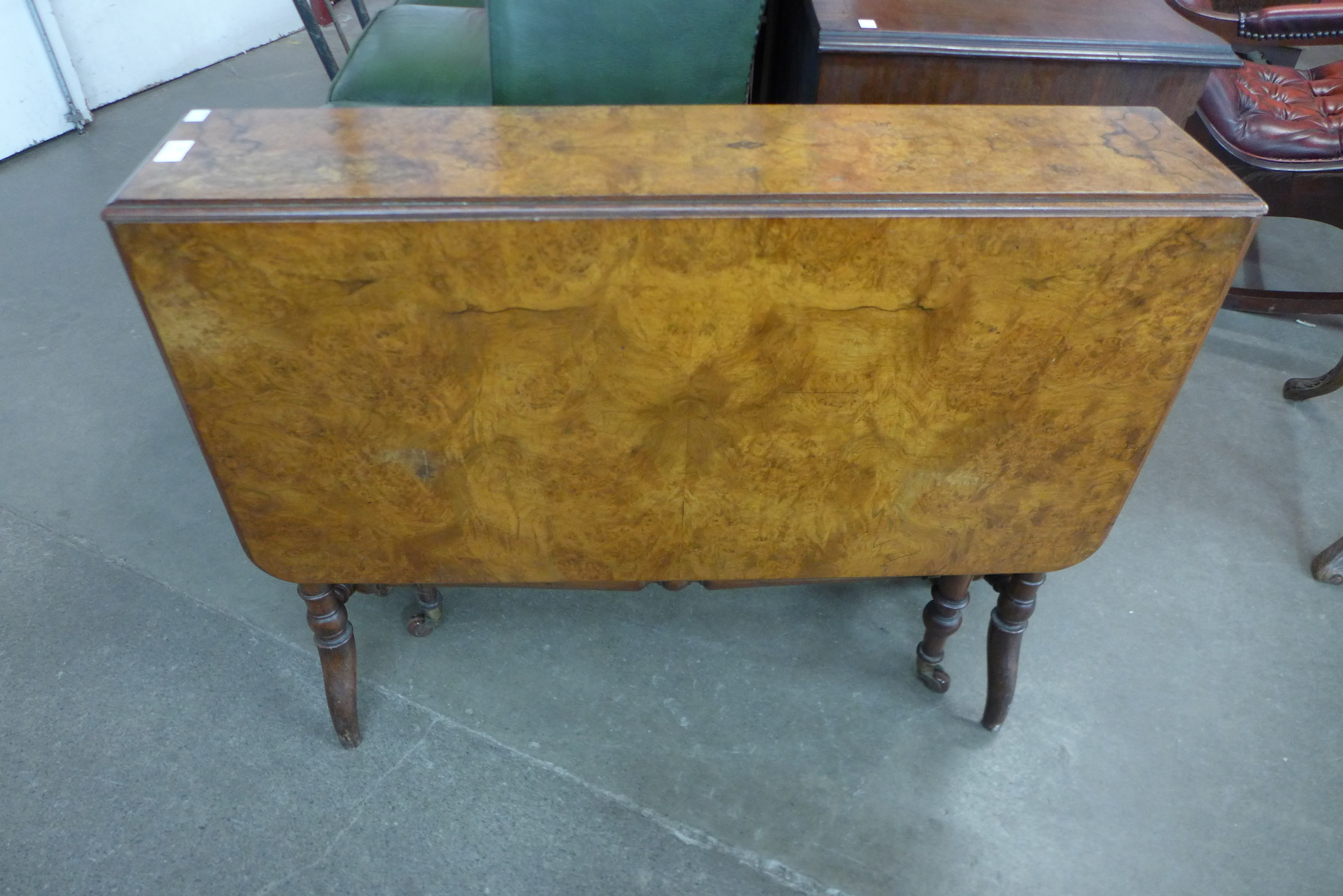 A Victorian figured walnut Sutherland table