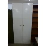 A large painted steel two door cabinet