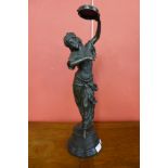 A French style bronze figure of a tambourine girl, on black marble socle