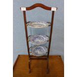 A mahogany cakestand with Copeland Spode blue and white tea plates