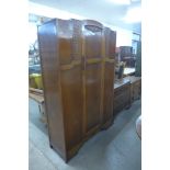 An oak wardrobe, chest of drawers and dressing chest