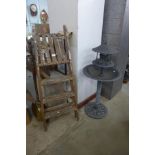 A faux metal bird bath and pine stepladders