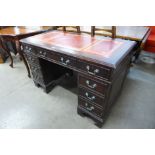 A mahogany pedestal desk