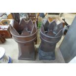A pair of glazed terracotta chimney pots