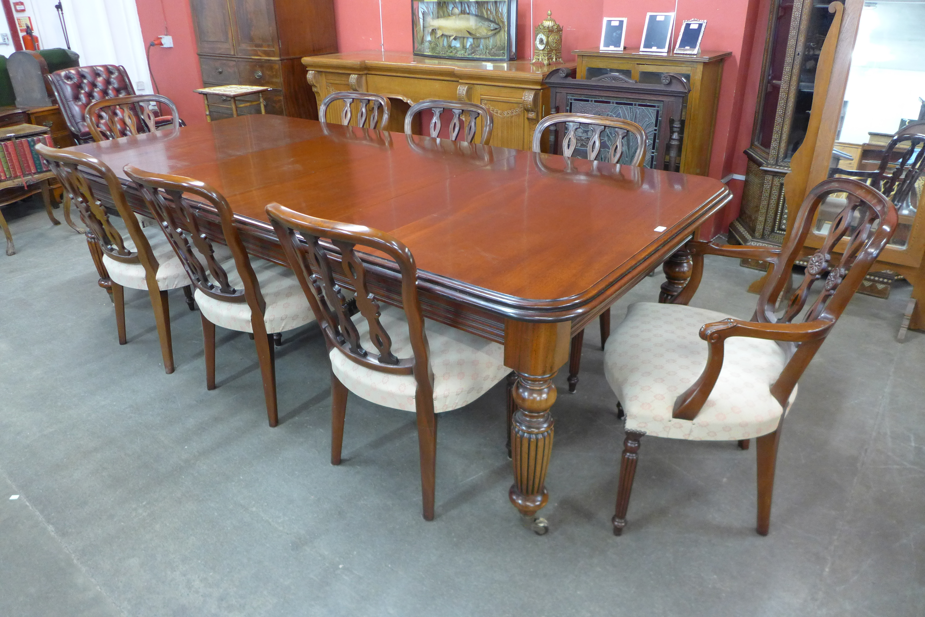 A Victorian style mahogany extending dining table and eight Hepplewhite style chairs, The Balmoral