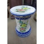 A small porcelain jardiniere stand