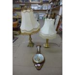A mahogany aneroid barometer and two brass table lamps