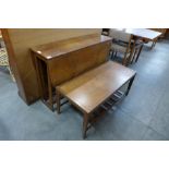 A teak drop-leaf dining table and a coffee table
