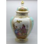 An early 20th Century Dresden baluster jar and cover with alternative panels of lovers and flowers