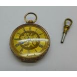A 9ct gold fob watch with key