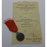 A WWII German Eastern Front medal with paperwork