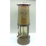 An E. Thomas & Williams Ltd. miner's safety lamp, No. 160786, with certificate,