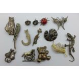 Twelve novelty silver brooches and a pair of earrings