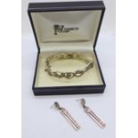 A silver The Rennie Mackintosh Collection bangle and a similar pair of earrings, boxed