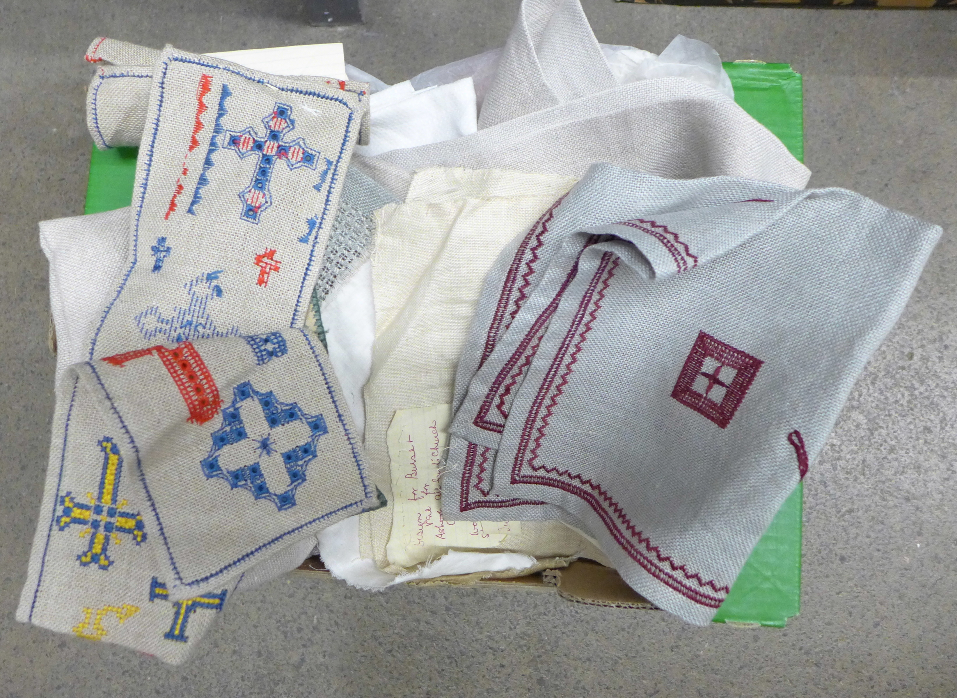 A collection of hand embroidered linens and needleworks