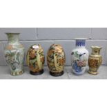 Three Oriental vases and a pair of pottery eggs with stands **PLEASE NOTE THIS LOT IS NOT ELIGIBLE
