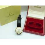 A 9ct gold Omega manual wind wristwatch, case back engraved, with 9ct gold buckle, boxed
