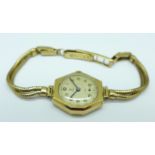 A lady's 9ct gold cased Tudor wristwatch, the bracelet strap stamped Rolex, the inner case marked