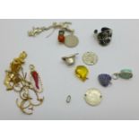 A collection of charms, a ring, etc., (earrings a/f)