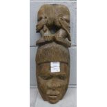 A carved African face mask