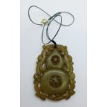 A large carved stone pendant, 6cm x 4.5cm