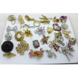 Approximately 30 costume brooches