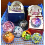 A collection of nine glass paperweights including one Langham