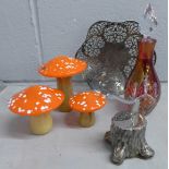 Three Caithness glass mushrooms, a glass scent bottle, a pierced dish and a novelty axe in tree