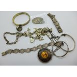 Four silver bracelets including a charm bracelet, three silver bangles, two pendants and chains