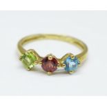 A 9ct gold, topaz, peridot and garnet ring, 1.4g, M