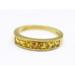 An 18ct gold Garrard ring set with seven square yellow stones, 3.5g, N