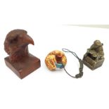 A modern eagle netsuke, signed, a novelty bronze seal and a shingle back lizard fob, (3)