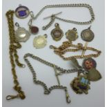 A collection of fobs and Albert chains including one silver Albert chain and three silver fobs