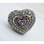A large silver gem set heart shaped ring, S