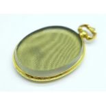 A hallmarked 9ct gold double sided picture locket