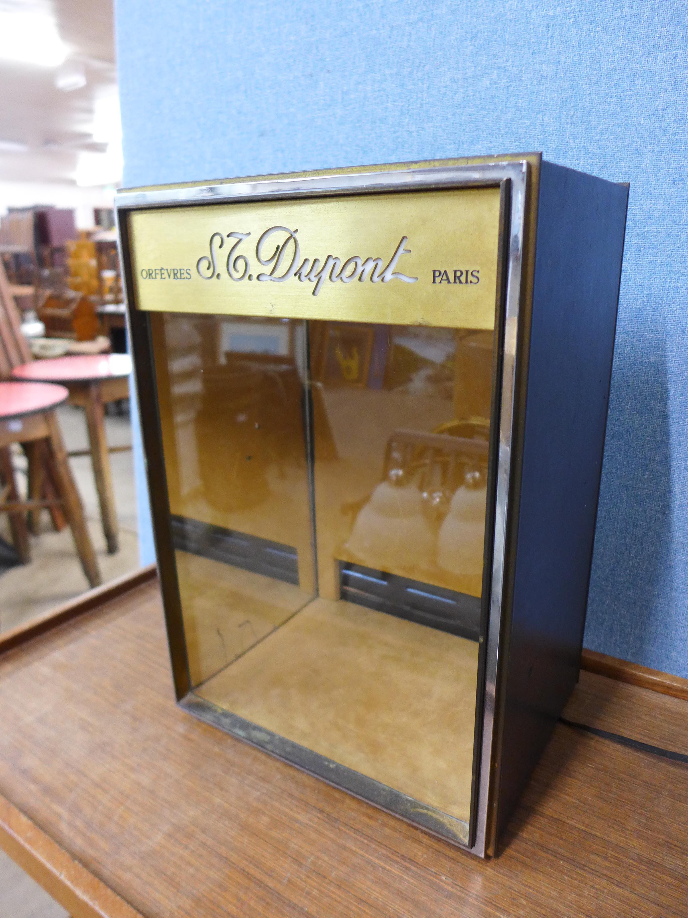 A French S.T. Dupont, Paris illuminated shop display cabinet, 44cms h, 30cms w, 24cms - Image 2 of 3