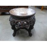 A Chinese marble topped padouk jardiniere stand, 34cms